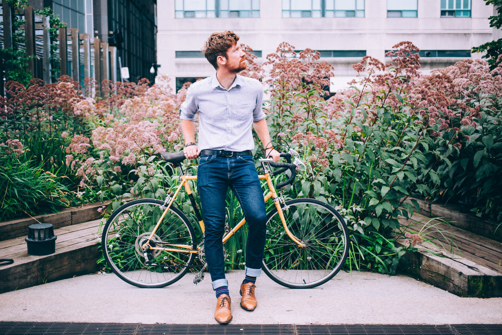 files/mens-fashion-man-in-shirt-and-jeans-leaning-on-bicycle.jpg